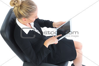 High angle view of beautiful young businesswoman sitting on an office chair