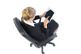 High angle view of modern businesswoman sitting on an office chair
