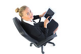 Portrait of blonde businesswoman sitting on an office chair