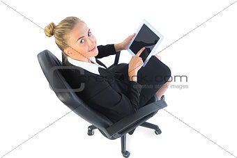 Portrait of blonde businesswoman sitting on an office chair