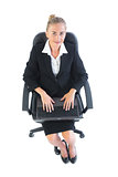 Smiling young woman sitting on an office chair