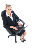 Attractive young businesswoman sitting on an office chair