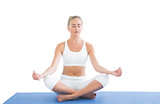 Toned relaxed blonde sitting in lotus pose