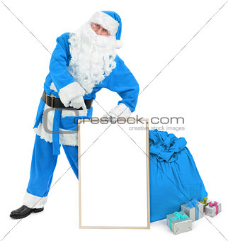 Funny blue Santa with empty white board 