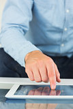 Close up of casual man using tablet