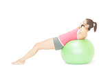 Attractive sporty brunette doing sit ups on exercise ball