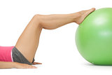Close up of female legs with exercise ball