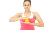Content sporty brunette holding yellow message ball