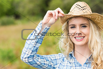 Pretty young woman wearing a straw hat