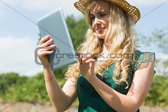 Young female farmer checking her tablet
