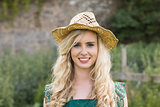 Cute young woman wearing a straw hat