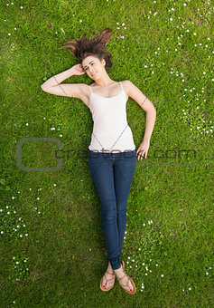 Pretty woman lying on a lawn