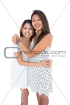 Two sweet sisters hugging each other