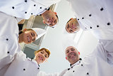 Five chefs standing in a circle