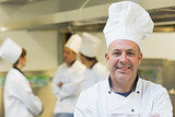 Mature male chef posing in a kitchen