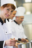 Young female chef smiling at the camera