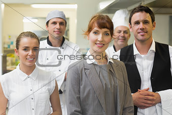Young female manager posing in a modern kitchen