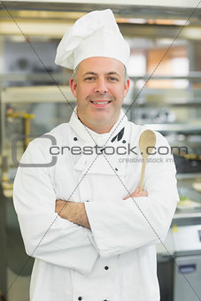 Mature head chef smiling at camera