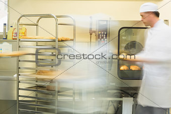 Two bakers working in the kitchen