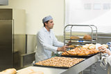 Young male baker working in a kitchen