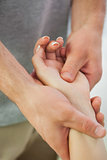 Patients hand being massaged by physiotherapist