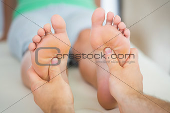 Physiotherapist giving a patient a foot massage