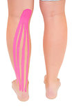 Patients leg with applied kinesio tape