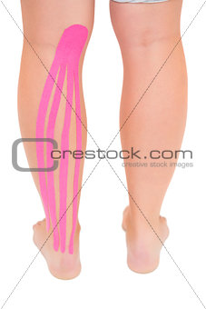 Patients leg with applied kinesio tape