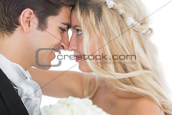 Happy young married couple looking each other in the face