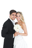 Sweet married couple posing holding a white bouquet
