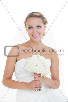 Attractive young bride posing holding a bouquet