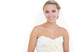 Attractive blonde bride posing and smiling at camera