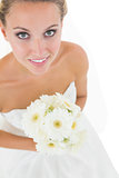 High angle view of cute bride holding a bouquet
