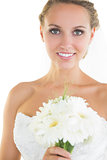 Gorgeous blonde bride posing holding a bouquet