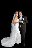 Content young couple posing holding champagne glasses
