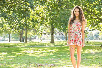Stylish smiling brunette looking into camera