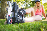 Casual attractive blonde wearing roller blades