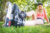 Casual attractive blonde wearing roller blades and helmet
