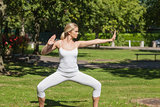 Serious blonde woman doing yoga