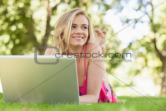 Happy attractive woman working with her notebook