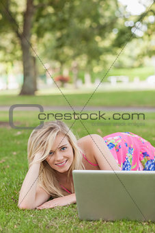 Cute woman posing on a lawn