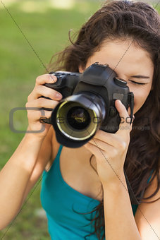 Gorgeous peaceful woman using her camera