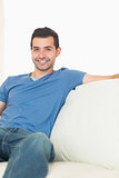 Casual content man relaxing on couch