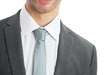 Mid section of businessman wearing blue tie