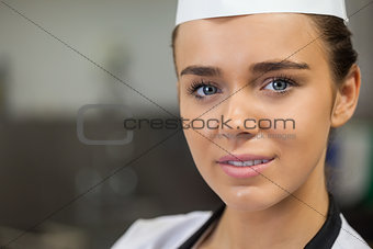 Young content chef looking at camera