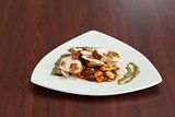 High angle view of chicken dish with salsa