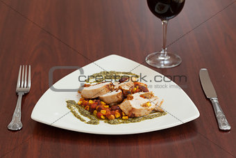 High angle view of delicious chicken dish with salsa