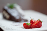 Close up of strawberries with chocolate cake