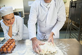 Head chef kneading dough