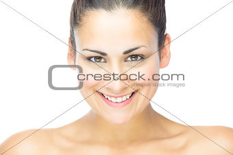 Front view of beautiful brunette woman smiling at camera